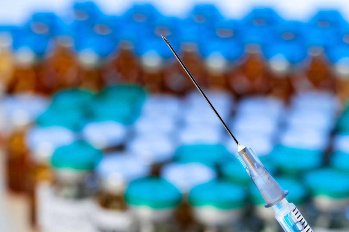 needle-of-a-syringe-against-pile-of-vials-close-up-2021-09-03-05-42-36-utc-1200x800.jpg